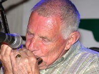 Tributes paid to folk musician and family man
