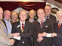 Tavistock and Yelverton's Rotary Clubs receive cheques for £600 from Widecombe Fair