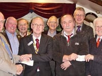 Tavistock and Yelverton's Rotary Clubs receive cheques for £600 from Widecombe Fair