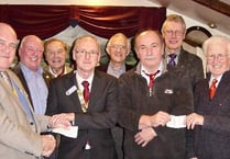 Tavistock and Yelverton's Rotary Clubs receive cheques for £600 from Widecombe Fair