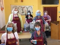 Team celebrates five months delivering family food parcels