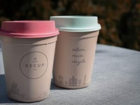 Buy someone a coffee and a cup and make them smile