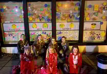 Brownies create window display for TASS