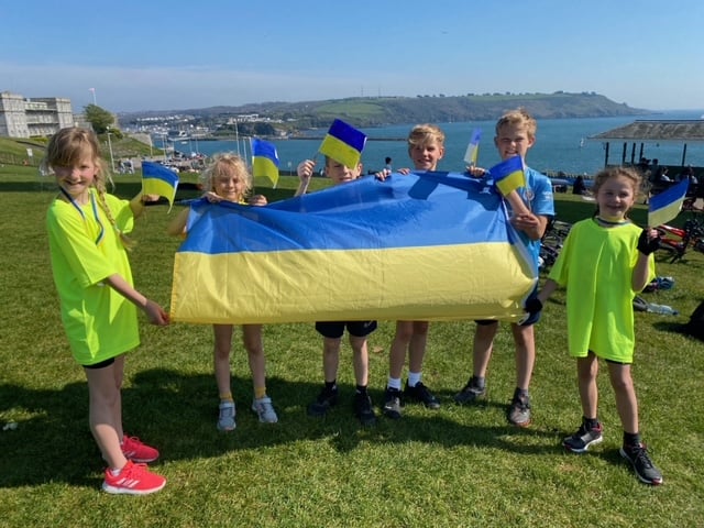 Youngsters at the finishing line at Plymouth Hoe  