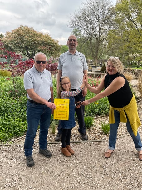 Sensory Garden Easter Trail winner Flora receiving her prize