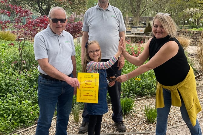 Sensory Garden Easter Trail winner Flora receiving her prize