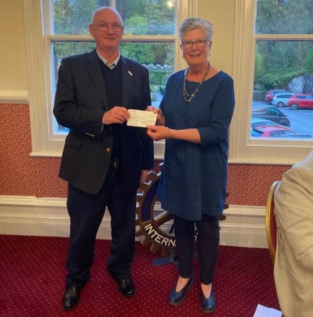 Club President Nigel Ellis presenting Joy Harrison with a cheque for £1,500