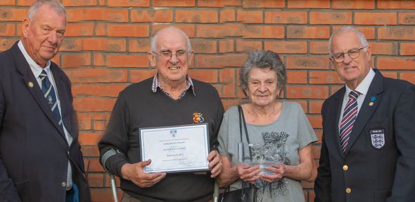 Derek and Yvonne Pethick are presented with award for services to football in West Devon