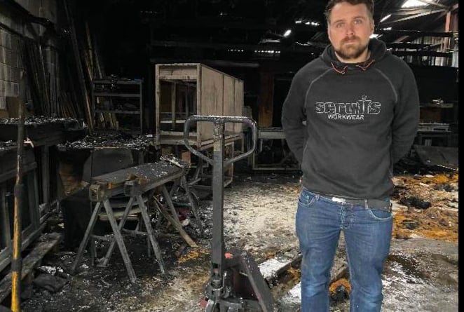 owner Harry Glover in fire-devastated workshop of The Pet Carpenter, Yelverton, October 2021