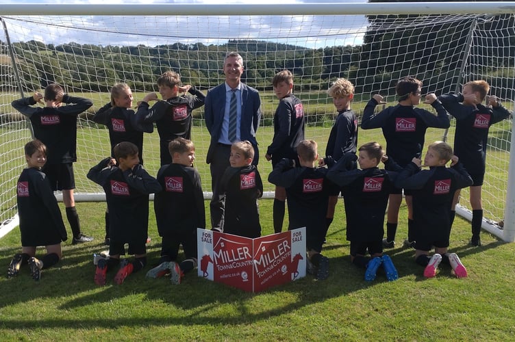 boys Under 12s team in new sweatshirts sponsored by estate agents
