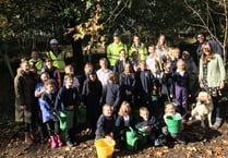Children sow wildflower meadow outside Dartmoor Prison