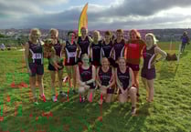 Tavi athletes run by the seaside in Cornwall