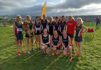 Tavi athletes run by the seaside in Cornwall