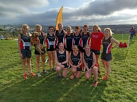 Tavi athletes run by the seaside in Cornwall