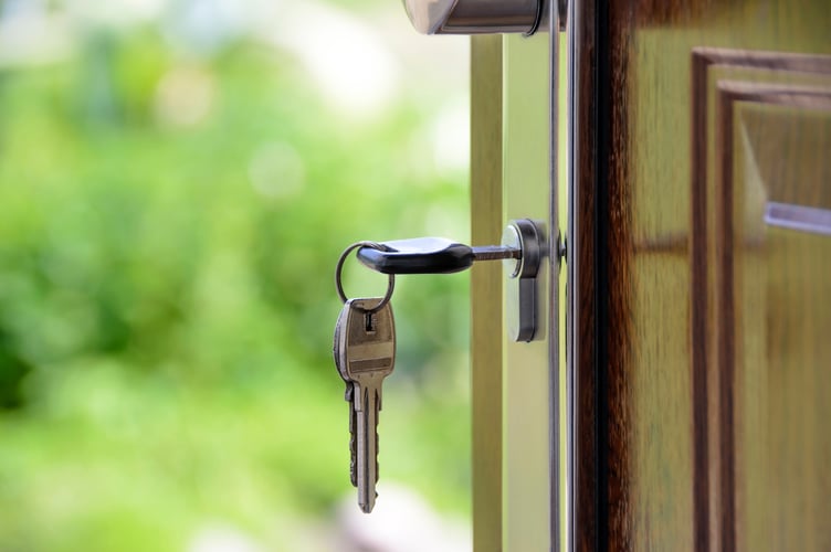 Key in front door - for housing stories