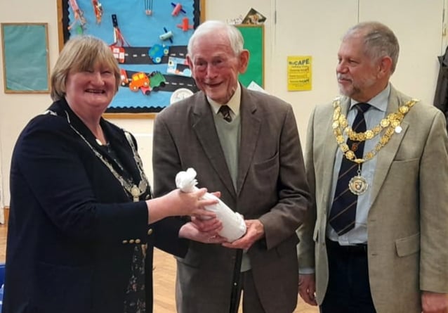 Kasey Jones was presented with a gift at the AGM of the Plymouth and West Devon Talking Newspaper by Councillor Caroline Mott, mayor of West Devon borough and Councillor Paul Ward, mayor of Tavistock to mark his retirement as recording engineer with the charity, a role he has carried out over 23 years.