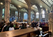 Children open Christmas Tree Festival with carols