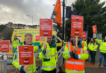 Striking ambulance workers man picket line