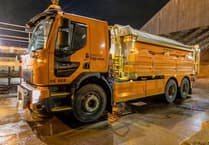 Gritter lorry overturns
