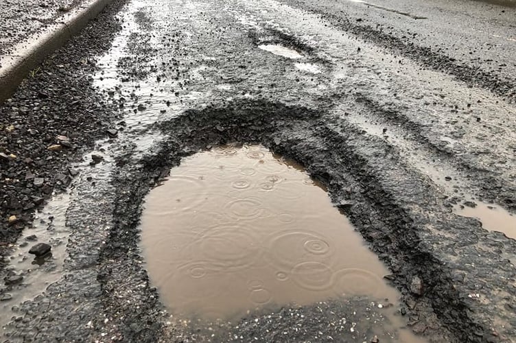 Pothole near Entrance to Batheway Fields  North Tawton