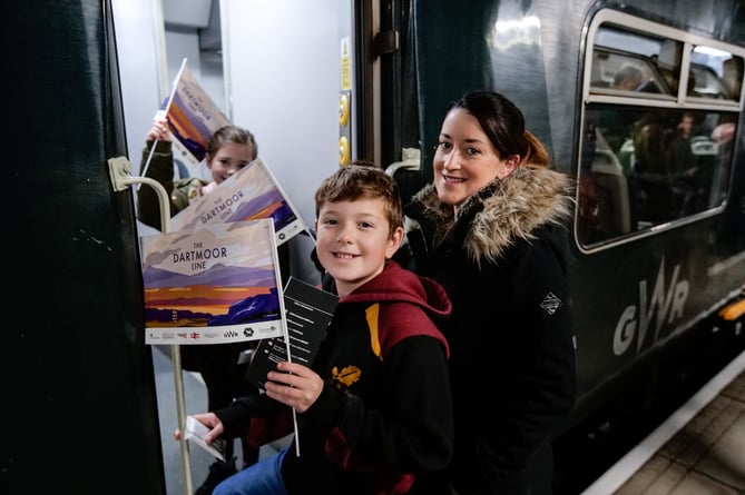 20th November 2021

Today marks the reopening of the Okehampton to Exeter railway line for regular passenger services for the first time in almost 50 years following a Â£40m investment of Government funding under the "restoring your railway" initiative.

Sarah Chammings of Okehampton boards the train with her children Zac and Maegan.

Photo Â© Tim Gander 2019. All rights reserved.