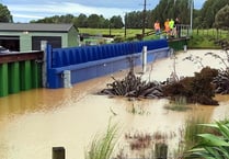 Town barriers stop flooding overseas