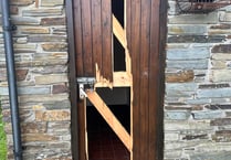 Cemetery toilet door damaged after a person got locked in by youths