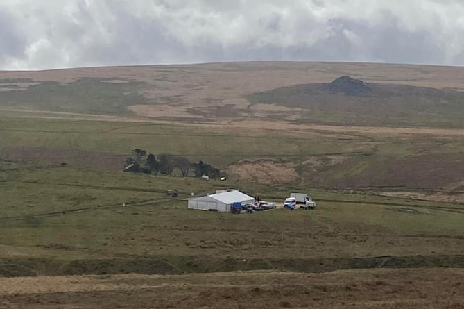 Mystery surrounds a marquee and multiple vehicles at a well-known filming location on SW Dartmoor.