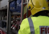 Fire crews battling blaze at yard