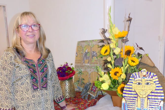 Tracy Johnson with her Egypt-inspired arrangement