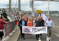 Hundreds march against toll charges
