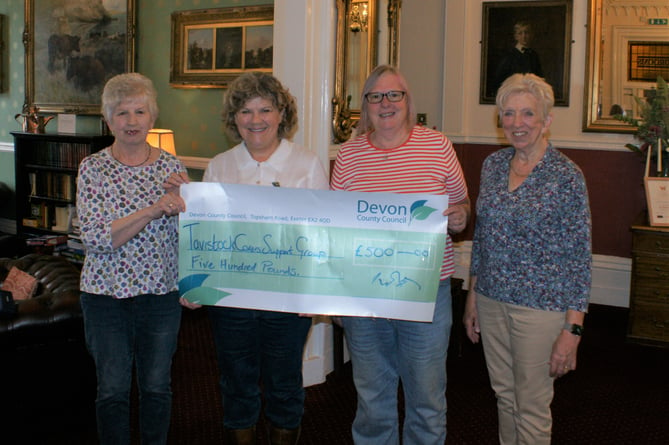 Tavistock Carers Support. Group receives funds from Cllr Debo Sellis (second left).