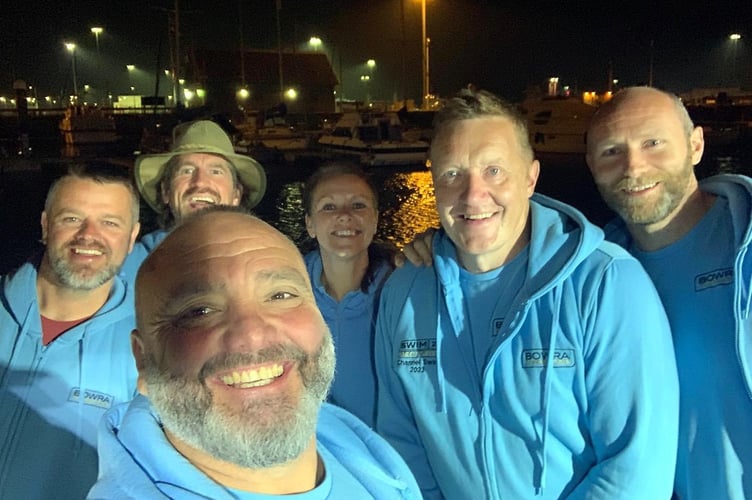 Lee Spencer and x channel swim before they started early this morning.