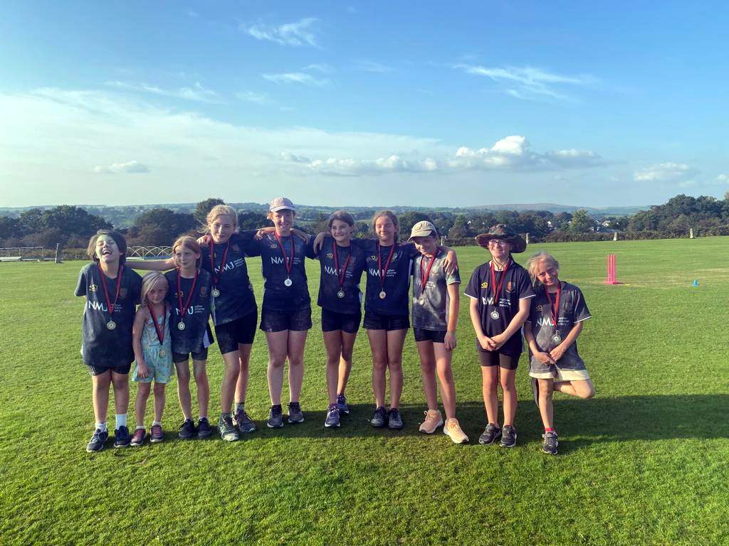 Female cricket bowls into town