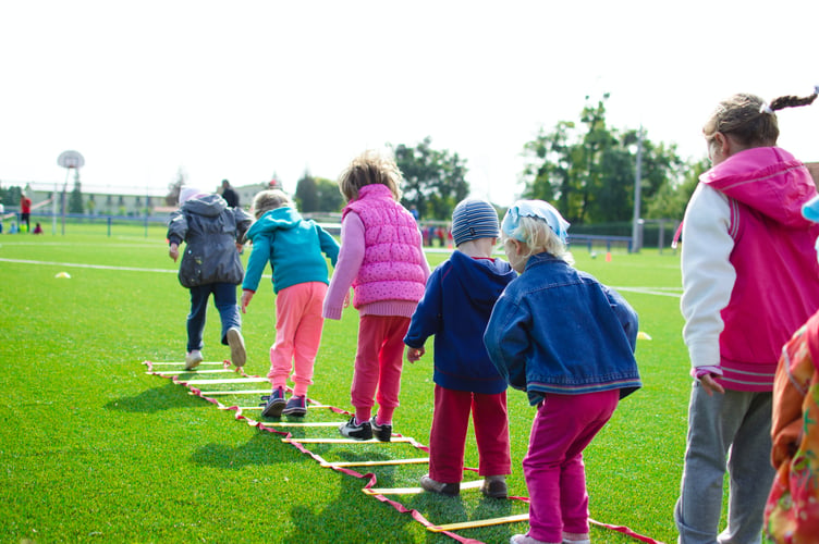kids have fund on play equipment