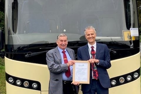 Clifford Down, left, receiving his Certificate of Appreciation from Devon County Council’s Damien Jones