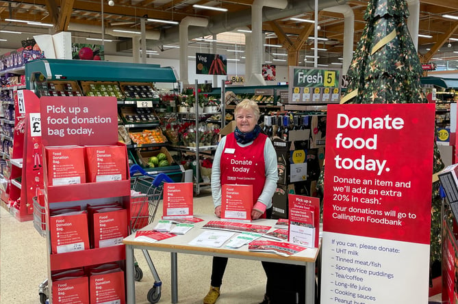 Helene Bryant, one of the Callington Foodbank warehouse volunteers in Callington Tesco encouraging shoppers to donate food items for the Tesco Winter Food Collection.