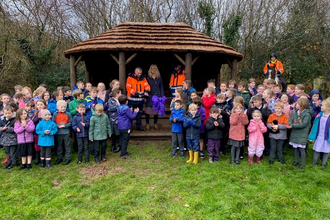 The children of Mary Tavy and Brentor Primary School with their revamped outdoor classroom and parent Ben Neale on horseback.