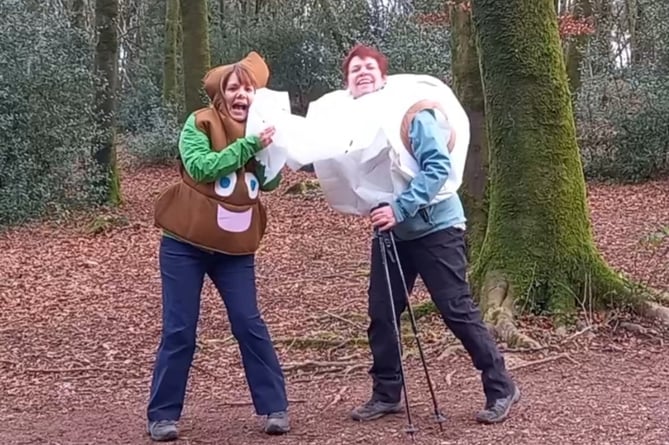 Charity walkers dressed as a poo emoji and toilet roll