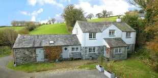 "Charming" cottage for sale sits beside stream with countryside views