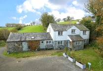 "Charming" cottage for sale sits beside stream with countryside views
