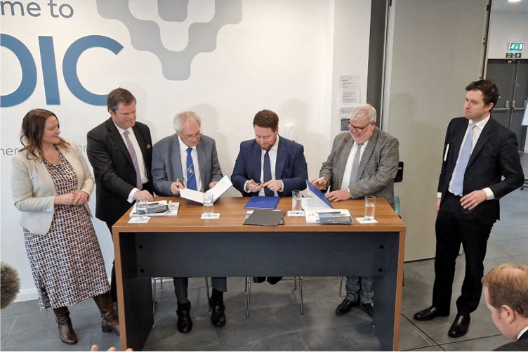 Signing the Torbay/Devon devolution deal (from left)  Alison Hernandez, Kevin Foster John Hart, Jacob Young, David Thomas, Anthony Mangnall