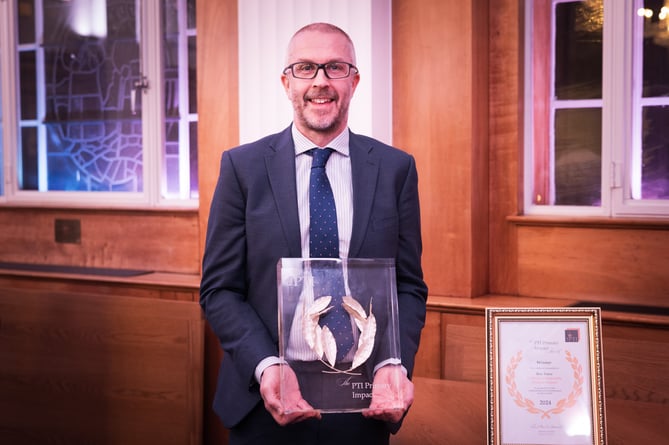 Calstock Primary School headteacher Ben Towe with the award