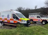 Volunteer rescuers help a stuck runner