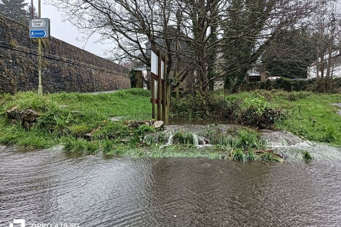 Pixon Lane car park entrance flooded by swollen stream