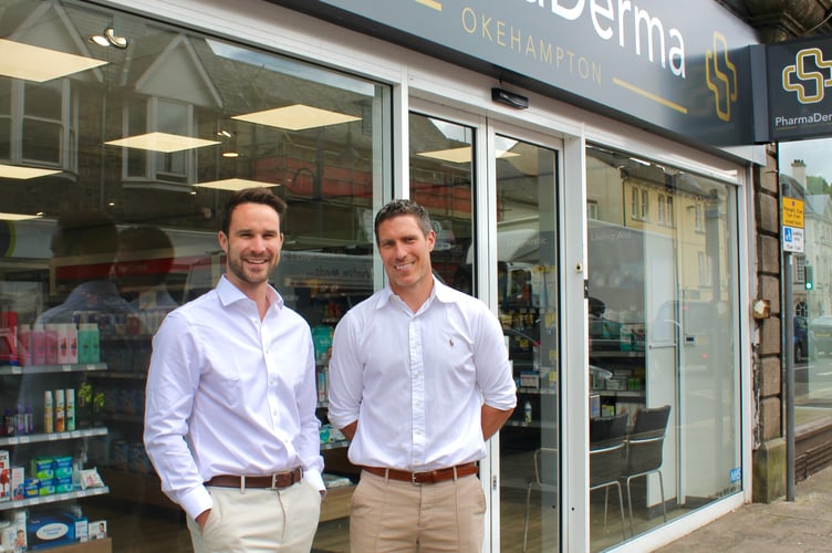Will and Rob outside their pharmacy on Okehampton's Fore Street