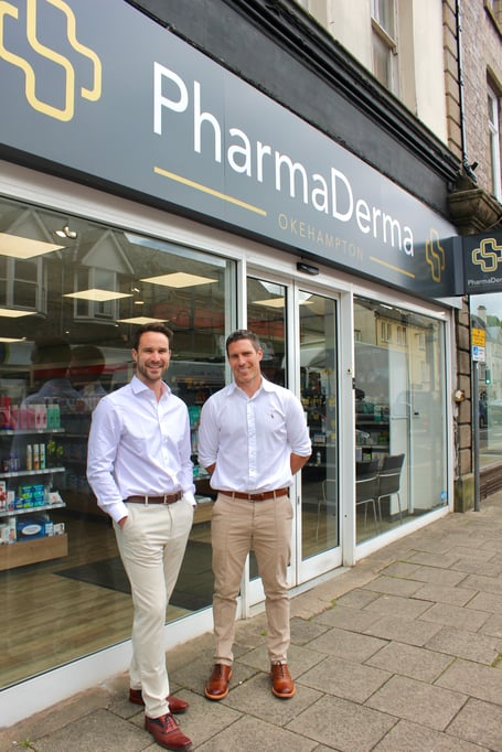 Will and Rob outside their pharmacy on Okehampton's Fore Street