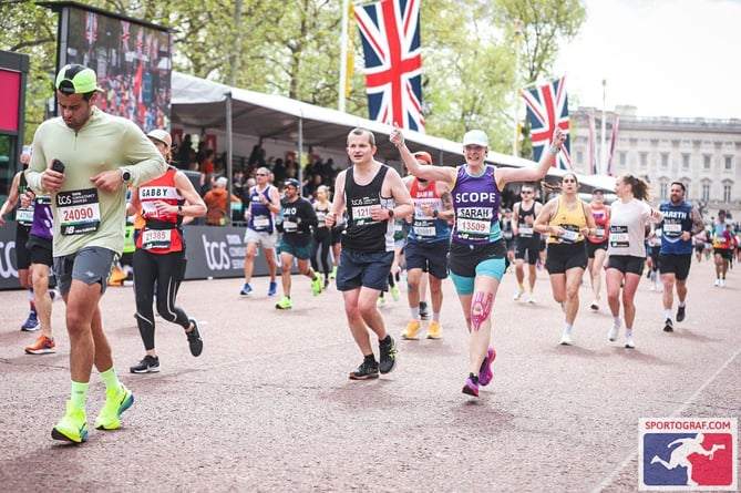 Sarah Rhodes finishes the London Marathon for Scope.