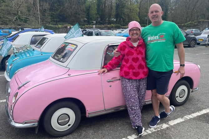 In the pink - a Figaro couple celebrate their car's character.