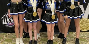 Cheerleaders bring gold home to Okey